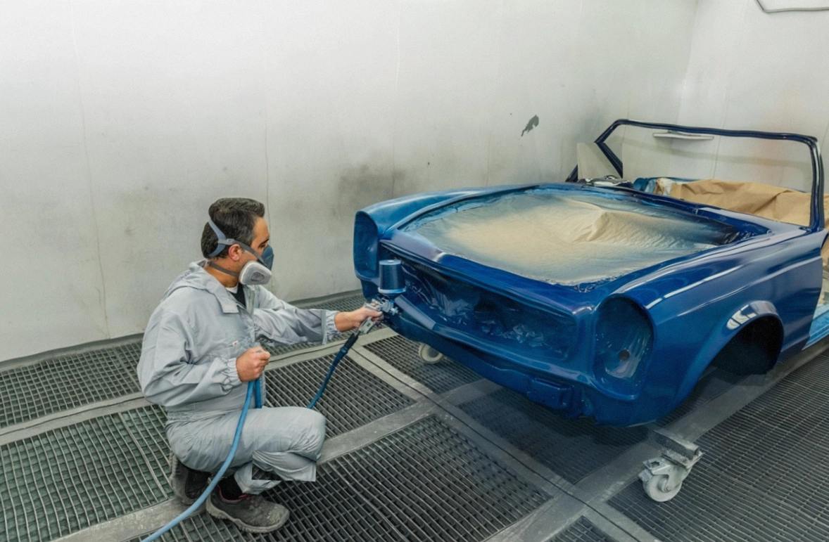 Mechanic photographing wear on a removed component
