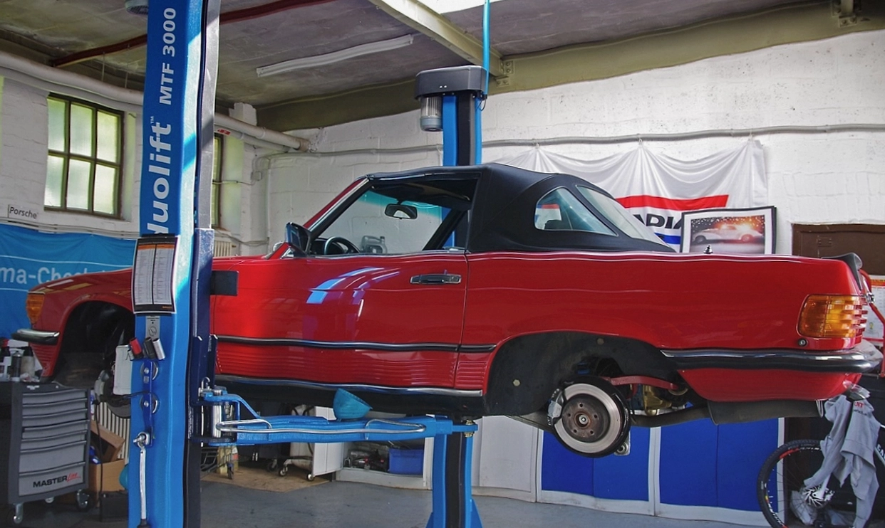 Torque wrench being applied to a wheel in the service bay